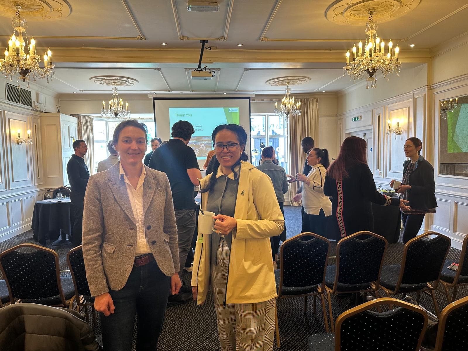 Palma Jacob at a professional event with a fellow attendee